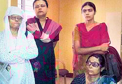 Sushma Verma and Mallige, activists with the Campaign and Struggle Against Acid Attacks on Women, along with acid attack survivors.