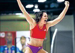 Jenn Suhr celebrates after setting a women's indoor pole vault world record on Saturday. REUTERS