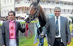 Jockey P S Chouhan (left) and trainer L V R Deshmukh leads in  Tintinnabulation after its victory in the Indian Turf Invitation Cup in Kolkata on Sunday.