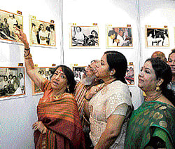 Engrossed: Veteran Kannada actresses take a look at the photographs on display.