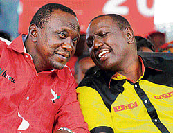 On electoral test: Kenyas Deputy Prime Minister and The National Alliance (TNA) presidential candidate Uhuru Kenyatta (L) speaks with his running mate William Ruto during a rally last Saturday. AFP file