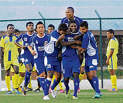 Man of the moment Mumbai Tigers N P Pradeep (2) is mobbed by his team-mates after scoring against Kalighat on Thursday. DH photo/ Kishor Kumar Bolar