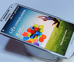 Samsung's new Galaxy S4 is seen during its unveiling on March 14, 2013 at Radio City Music Hall in New York. The slim, feature-rich Galaxy S4 was introduced as Samsung's new champion in the fiercely competitive smartphone arena, scheduled to roll out in 155 countries in late April. AFP PHOTO
