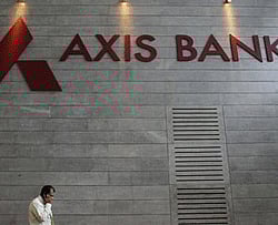 An employee's shadow is cast on the ICICI Bank logo at their headquarters in Mumbai April 26, 2012. REUTERS-Vivek Prakash-Files Personal bankers wait for customers at the reception of a HDFC Bank branch in Mumbai November 17, 2012. REUTERS-Vivek Prakash-Files  1 of 3. An employee speaks on his mobile phone as he walks inside Axis Bank's corporate headquarters in Mumbai July 17, 2012.  Credit: Reuters