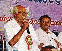The 12th District Kannada Sahitya Sammelan president, Sa Raghunath, speaks at a seminar organised as part of the meet in Malur on Sunday.
