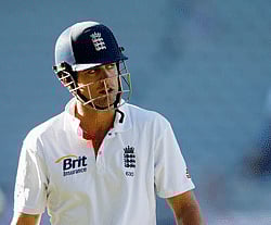 England's Alastair Cook looks at the action replay as he leaves the field after being dismissed against New Zealand on day four of their final cricket test at Eden Park in Auckland, March 25, 2013. REUTERS