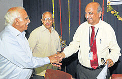 legal views: Vice-chancellor of National Law School of India University R Venkata Rao being greeted by the chairman of Mahajana Education Society R Vasudevamurthy at SBRR Law College in Mysore, on Thursday. Director of the college C K N Raja is seen. DH Photo