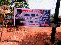 A poster announcing villagers decision to ban voting. DH photos