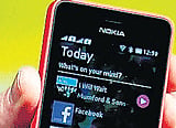 Nokia pushes $99 phone to retain market pie