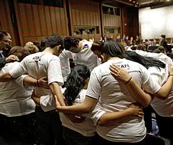 Supporters for immigration reform say a prayer prior to the start of the reform bill's markup before the Senate Judiciary Committee on Capitol Hill May 9, 2013 in Washington, DC. The 18 members of the committee have proposed in excess of 300 amendments to the 844 page piece of legislation that would, if passed, create a path to U.S. citizenship for undocumented immigrants.  AFP
