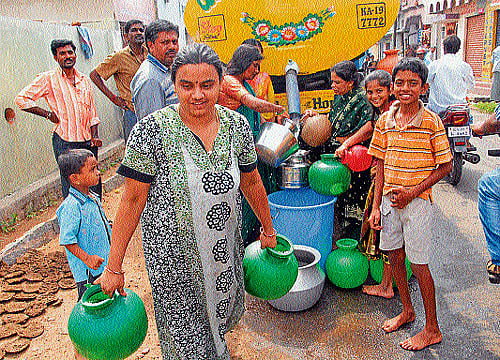 alternative: With water supply being affected in majority of the areas in Mysore, tankers are pressed into service to supply water to the affected areas. dh photo