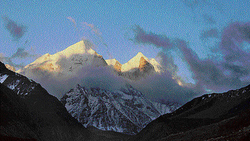 Divine: Clouds descend on the snow-peaked Himalayas. Photo By Authors.