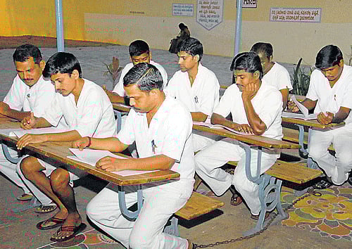 Studious: Inmates of Central Prisons, Mysore, who have opted for courses with Karnataka State Open University (KSOU), prepare for examinations, in Mysore. DH Photo
