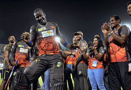 SRH's Darren Sammy dances as the team celebrates its win over KKR in a crucial match IPL-6 at Rajiv Gandhi International Cricket Stadium in Hyderabad on Sunday. PTI Photo