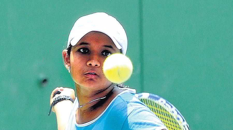 Poised to strike: Tanvi Bhat Hattangadi sets up a forehand return during her win over Bhavya Ramineni in the ATF under-14 Asian Junior ranking tournament. DH PHOTO