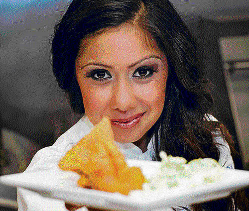 Snack on these: Suzy Singh; and samosas. PHOTO by span