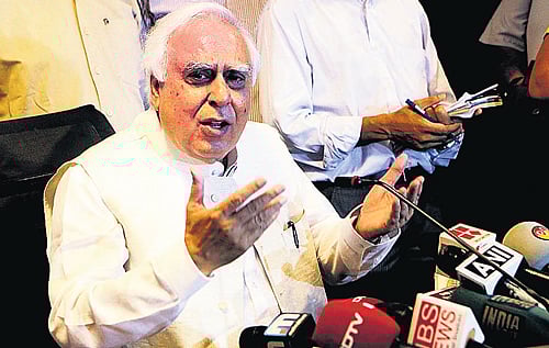 Union Law Minister Kapil Sibal addresses a press conference in New Delhi on Saturday. PTI