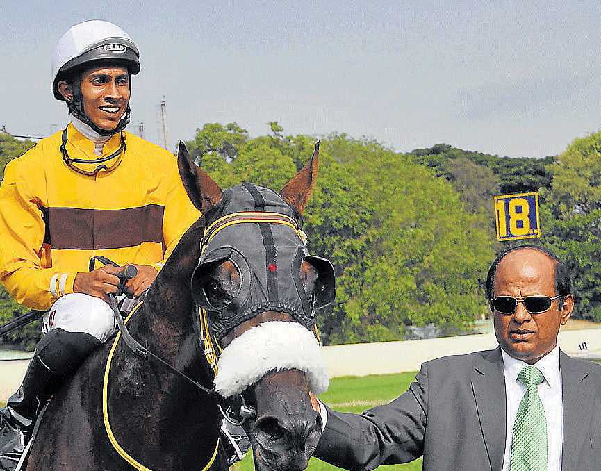Easy win : Trainer S Ganapathy (right) with his colt Murioi (B Sreekanth up) after winning the Nanoli Stud Juvenile Million in Bangalore on Sunday. dh photo