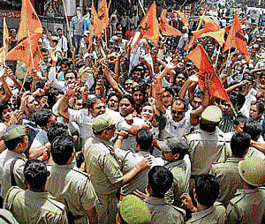Shiv Sena activists object to withdrawal of terror charges against a blast accused by the UP government. PTI photo