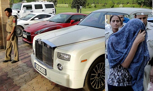 South Indian actress Leena Maria Paul, (inset) with face covered, arrested by Delhi police from a farmhouse with nine expensice cars, on Tuesday. PTI Photo