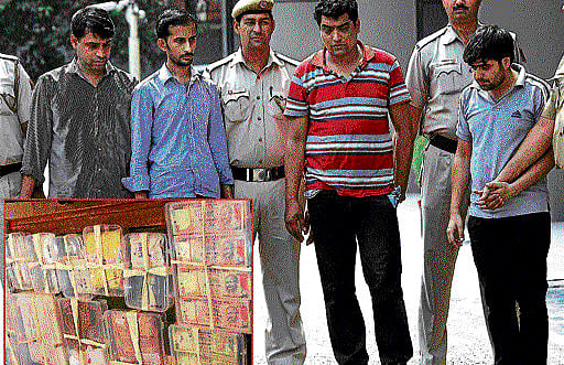 Arrested employees of Muthoot Finance at police headquarters on Sunday. PTI