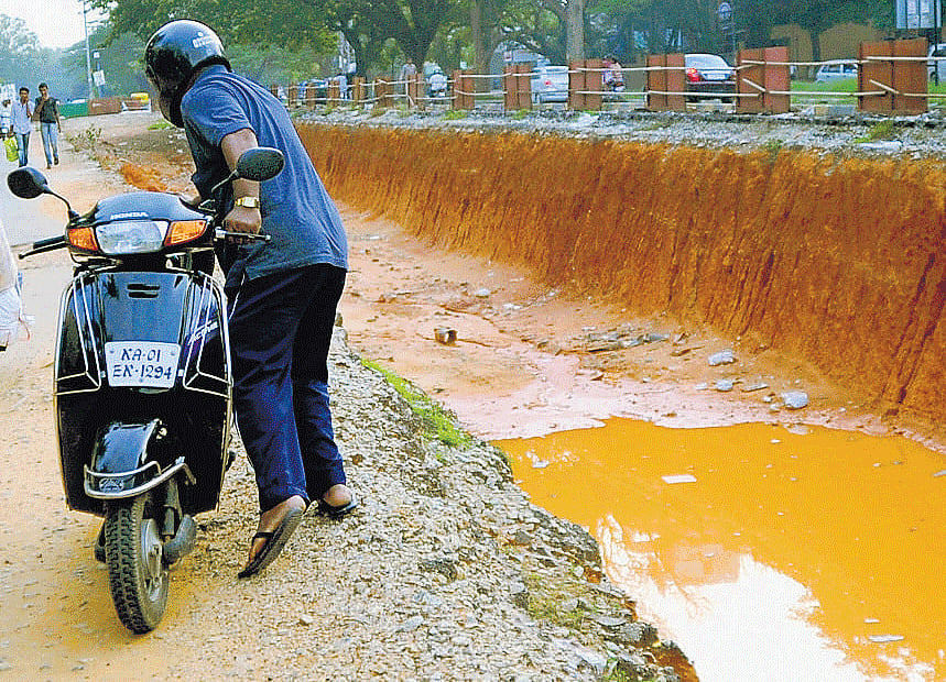 The Sarjapur Road that was dug up for construction of an underpass near St John's Hospital Junction will be restored in four months. dh photo