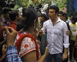 Actor Aditya Pancholi, in white, argues with members of the media during the funeral of Bollywood actress Jiah Khan in Mumbai, India, Wednesday, June 5, 2013. Police said that Khan was found dead at her home in Mumbai late Monday. Khan began her career in Mumbai's film industry in the 2007 Hindi film 'Nishabd' in which she portrayed a teenager in love with her best friend's father, played by Bollywood superstar Amitabh Bachchan.