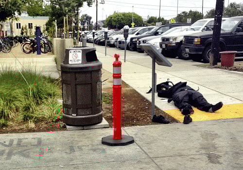 The body of a man believed to be the suspect in a shooting incident at Santa Monica College lies on the sidewalk in Santa Monica Reuters Image