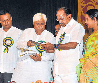 Food and Civil Supplies Minister Dinesh Gundu Rao, Rural Development and Panchayat Raj Minister H K Patil, Union Petroleum Minister M Veerappa Moily and Women and Child  Welfare Minister Umashree at the inauguration of the Golden Jubilee celebrations of  Textile Co-Operative Bank Ltd in Bangalore on Sunday. DH photo