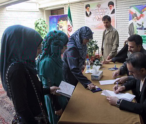 Iranian voters cast their ballots to choose a new president at the Iranian embassy in Damascus, Syria, June 14, 2013. What Iran's next president can potentially influence is the tone and tactics with world powers if stalemated nuclear talks resume at some point after a successor is picked for the firebrand President Mahmoud Ahmadinejad. (AP Photo)
