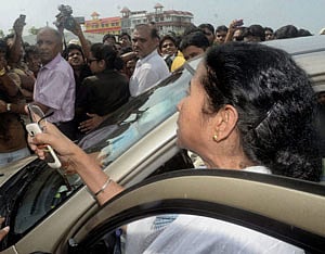 Villagers protest as West Bengal Chief Minister Mamata Banerjee leaves after meeting family of the 20-year-old girl who was raped and brutally murdered, earlier this month, in Kamduni on Monday. PTI Photo