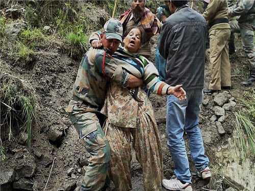 Army personnel carrying out relief operations in flood-hit Chamoli district on Tuesday. PTI Photo