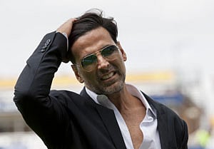 Actor Akshay Kumar waits to be interviewed during India's ICC Champions Trophy cricket match against Pakistan at Edgbaston cricket ground, Birmingham, England, Saturday June 15, 2013. AP photo