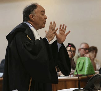 Ennio Amodio, defence attorney of the former Finmeccanica CEO Giuseppe Orsi, speaks at the opening of a corruption trial against Finmeccanica, at the Busto Arsizio court, northern Italy, Wednesday, June 19, 2013. Trial opened Wednesday against the former head of the Italian aerospace and defense giant Finmeccanica accused of corruption in a case involving alleged bribery to win a 560 million euro (670 million dollars) helicopter contract in India. Giuseppe Orsi, who resigned in February, faces charges of fraud and corruption in a case that has both tarnished the international image of the state-controlled company, Italy's second-largest industrial concern, and jeopardized the defense contractor's strategy to expand in India as the nation upgrades its military. Defendants in Italy are not required to appear their own trials and Orsi did not attend the opening session. AP Photo.