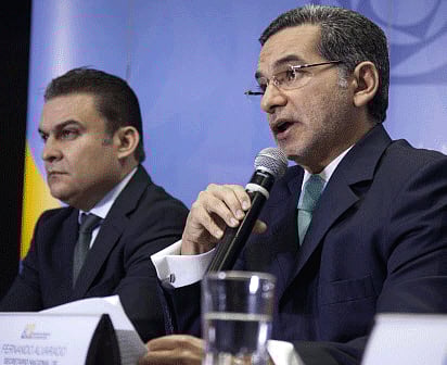 Ecuador's Interior Minister Jose Serrano (L) and National Secretary of Communications Fernando Alvarado attend a news conference at the Ecuadorian National Media Building in Quito June 27, 2013. REUTERS