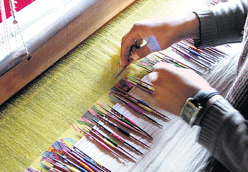 magical weaves (Clockwise from above) Soft and silky Pashmina shawls; a 'kani-jamavar' pashmina shawl being woven (Photo by author)