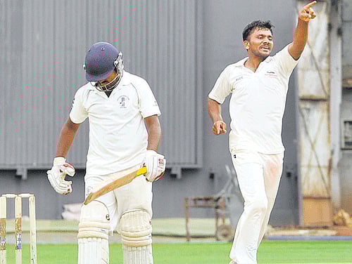 on a high Dharwad Zone's Parappa Mordi celebrates after dismissing Raichur Zone's Sanjeeb Nayak at the M Chinnaswamy stadium on Saturday. DH PHOTO