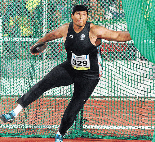 heaving it long: Vikas Gowda gave India first gold by winning the men's discus in Pune on Thursday. Pti