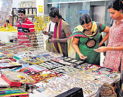 curious: Visitors taking a look at the products.