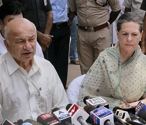 UPA Chairperson Sonia Gandhi along with Union Home Minister Sushil Kumar Shinde talking to media after visiting the Mahabodhi Temple in Bodhgaya on Wednesday. PTI Photo