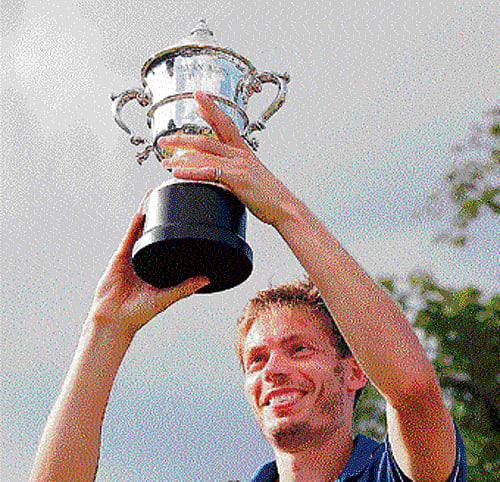 jubilant: Frenchman Nicolas Mahut with the trophy after beating Lleyton Hewitt of Australia in the final of the Hall of Fame Championship in Newport on Sunday. AP