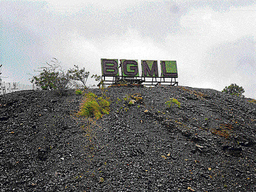 Fading glory:(Left) The Bharat Gold Mines Limited's logo is one of the vestiges of a proud industrial heritage (top right) that flourished for close to two centuries. The cyanide hills (above) wrecked havoc in locals' lives. The Champions Reef mine (below) has only obsolete machinery and little else to show today. (Photos by author)