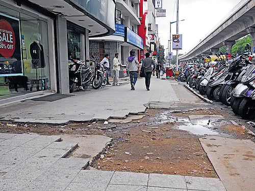 The business community has demanded that the pavement be re-tiled and has sought more dustbins on the footpath to keep MG Road clean. DH PHOTO
