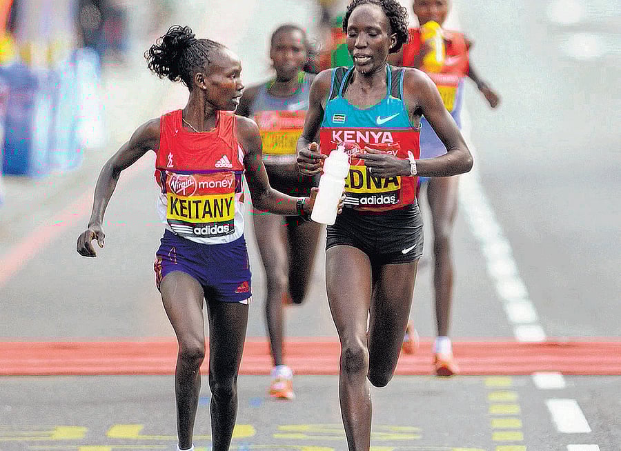 going for gold Edna Kiplagat (right) says she misses running with Mary Keitany, who has taken a break from athletics after giving birth recently. FILE PHOTO