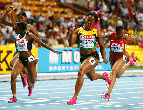 Shelly-Ann Fraser-Pryce of Jamaica (4) crosses the finish line ahead of Murielle Ahoure of Ivory Coast (6) and Carmelita Jeter of the U.S. (5) to win the women's 100 metres final during the IAAF World Athletics Championships at the Luzhniki stadium in Moscow August 12, 2013. REUTERS/