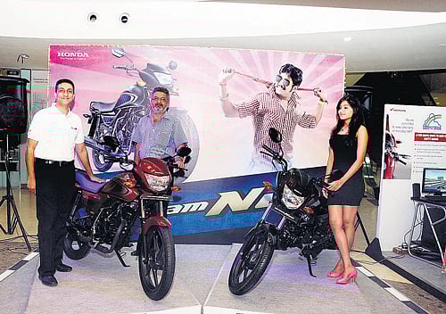 Ashish Choudhary with a DREAM NEO 110-cc bike