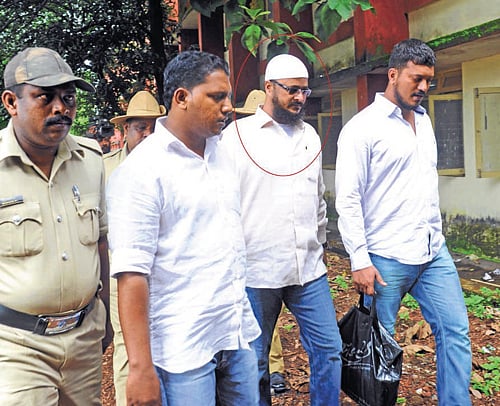 facing the music: Dawood Ibrahim's aide, Rasheed Malbari is being escorted to court. dh photo