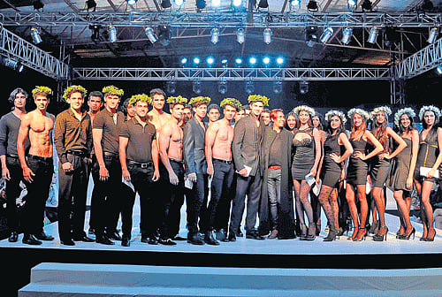 celebrating: The winners of the competition with fashion choreographer Kevin Oliver(centre).