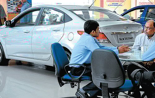 Auto: Rupee fuels auto woes, brakes sales
