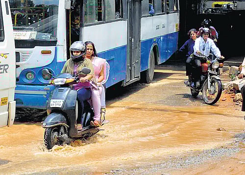 endless woes: The underbridge near Cox Town market is flooded with rainwater. DH Photos